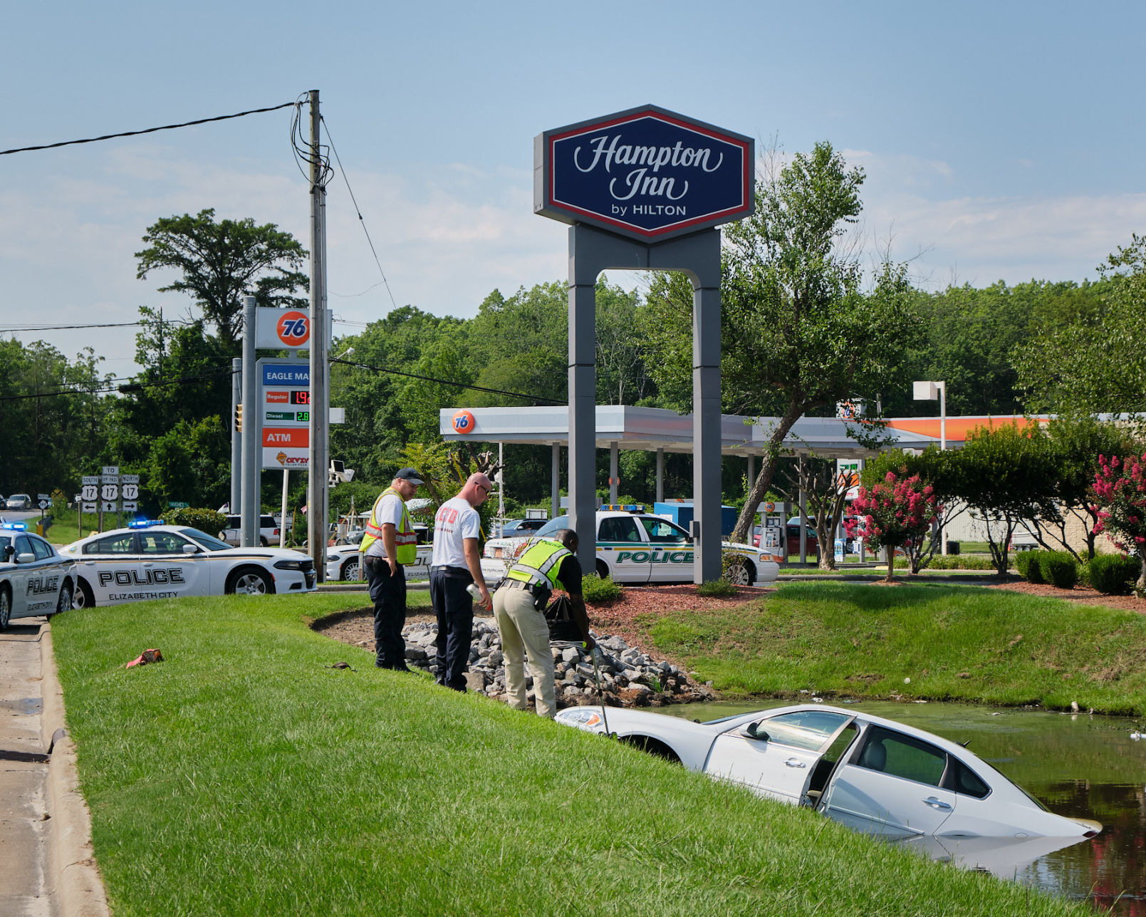 Car ends up in retention pond